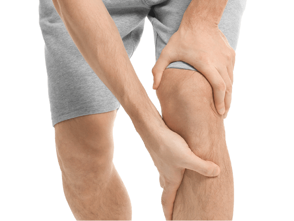 Someone gripping their knee in pain image