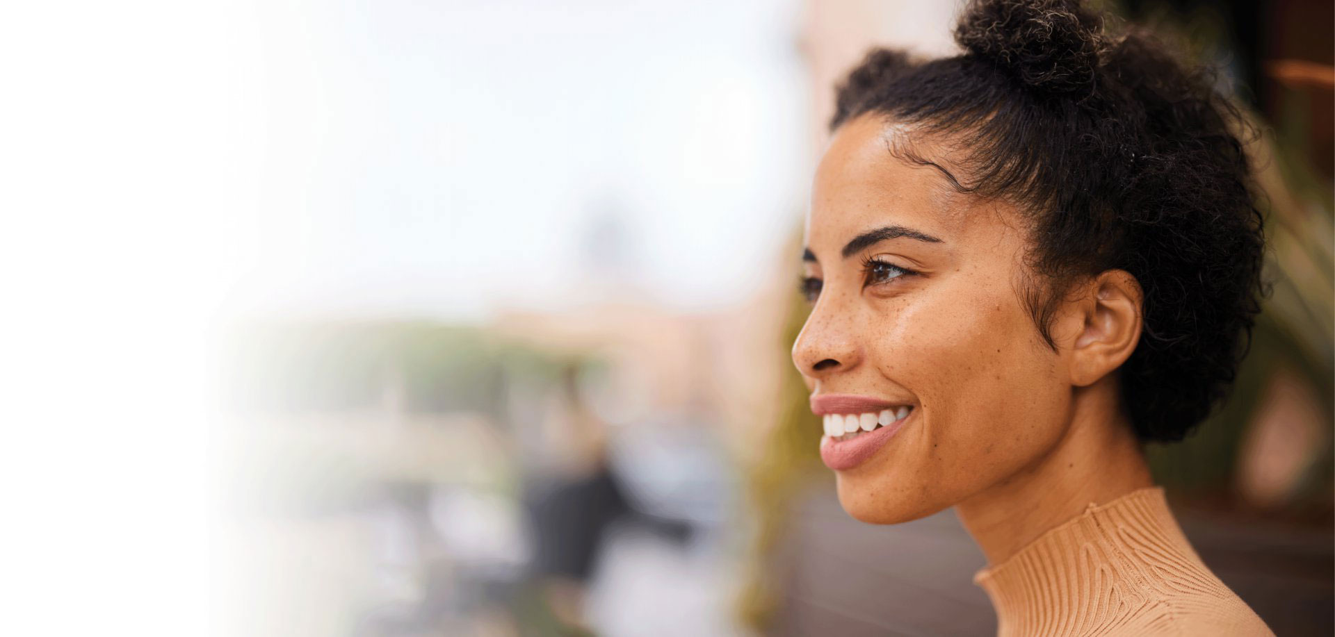 close-up profile of a healthy woman smiling